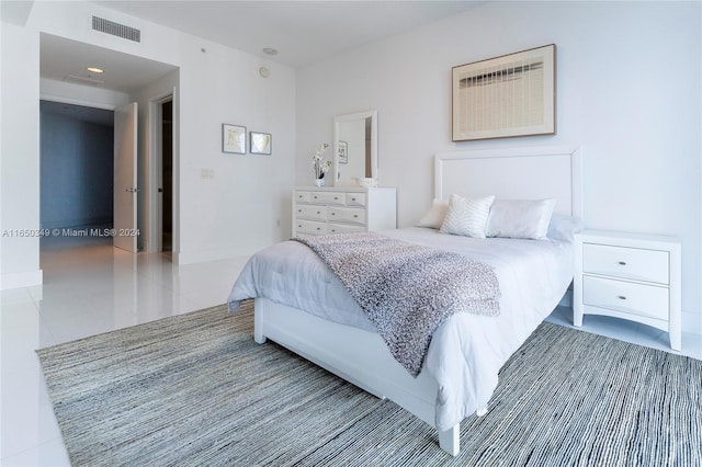 bedroom with tile patterned floors