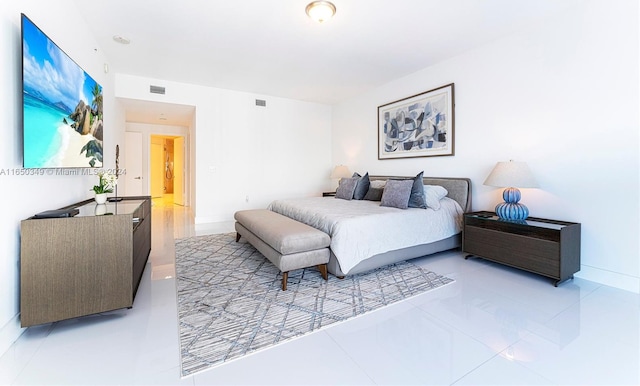 bedroom featuring light tile patterned floors