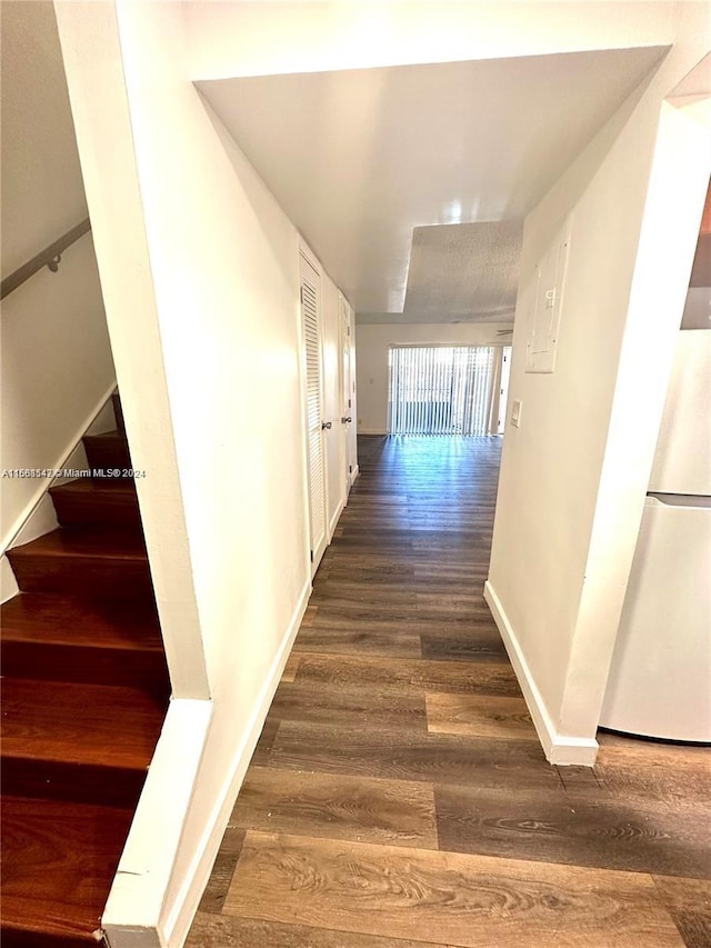 hall with dark hardwood / wood-style floors