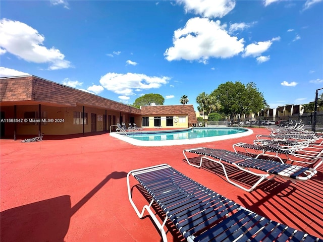 view of swimming pool featuring a patio area