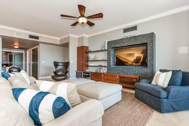 living room featuring ceiling fan and crown molding