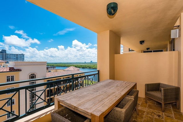 balcony featuring a water view