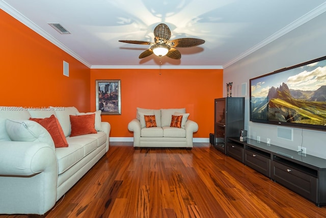 living room with ornamental molding, ceiling fan, and dark hardwood / wood-style floors