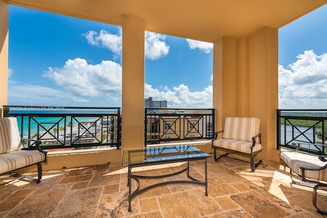 balcony featuring a water view