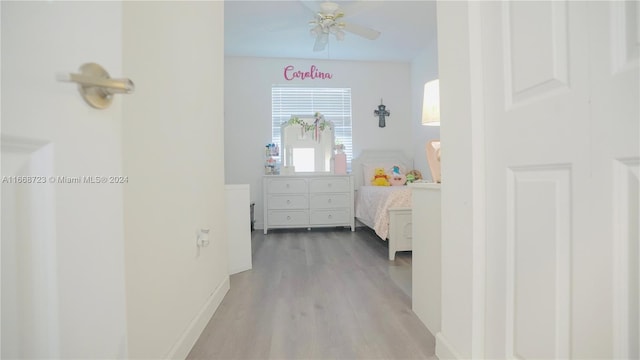 bedroom with ceiling fan and hardwood / wood-style flooring