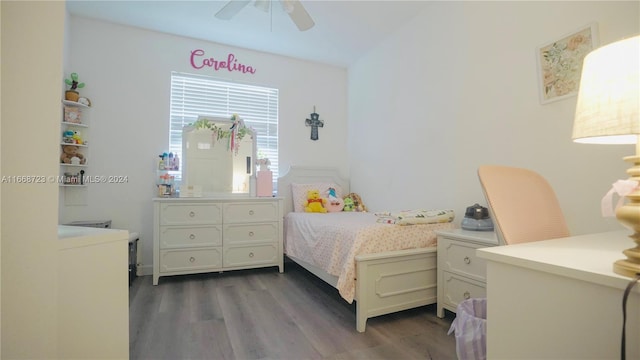 bedroom with ceiling fan and dark wood-type flooring