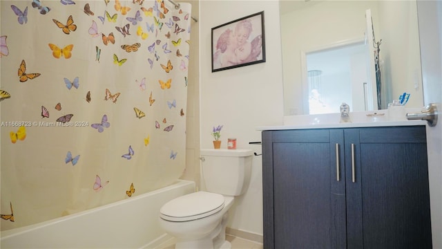 full bathroom featuring vanity, tile patterned flooring, toilet, and shower / tub combo with curtain