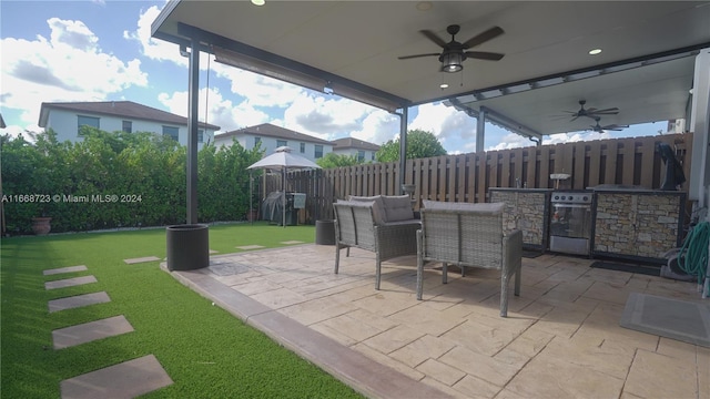 view of patio / terrace featuring ceiling fan and area for grilling