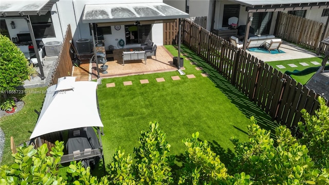 view of yard featuring an outdoor hangout area, central AC, and a patio area