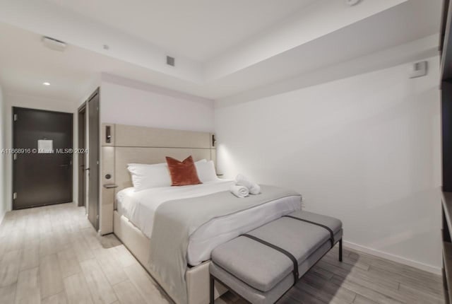 bedroom featuring light wood-type flooring