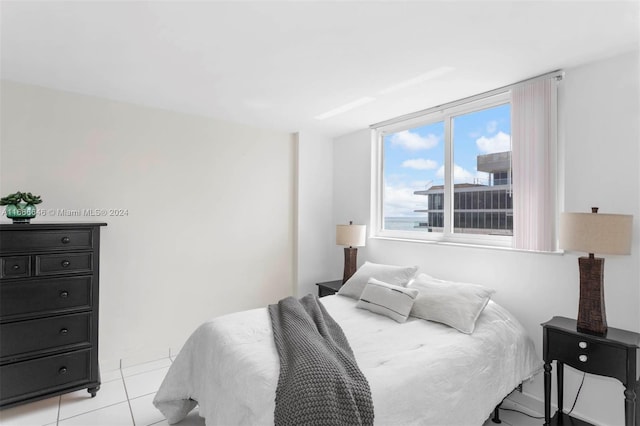 bedroom with light tile patterned floors