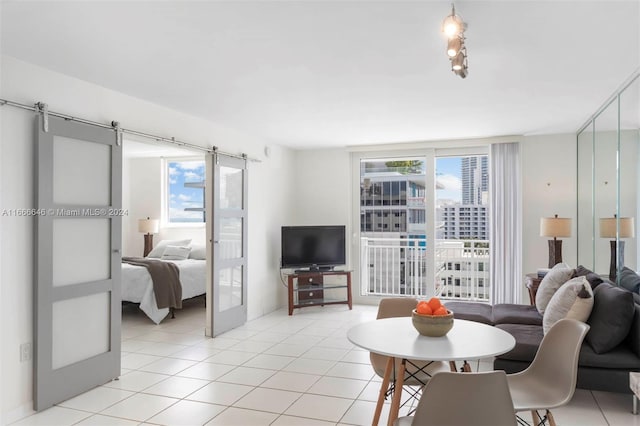 living room featuring french doors, light tile patterned floors, and plenty of natural light