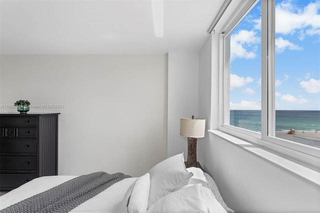 bedroom featuring a water view