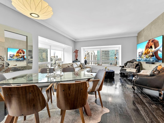 dining area with hardwood / wood-style floors and a wealth of natural light