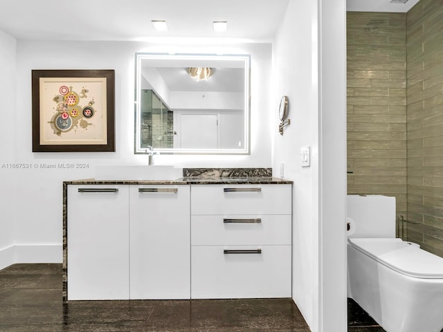 bathroom featuring wood-type flooring, vanity, and toilet