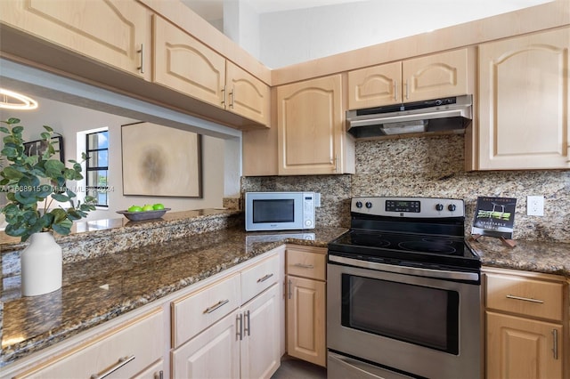 kitchen with decorative backsplash, dark stone countertops, light brown cabinets, and stainless steel electric range