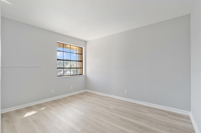 spare room featuring light hardwood / wood-style flooring