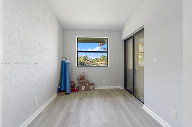 empty room with light hardwood / wood-style floors