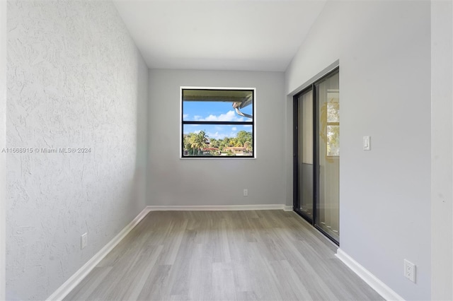 spare room with light hardwood / wood-style floors