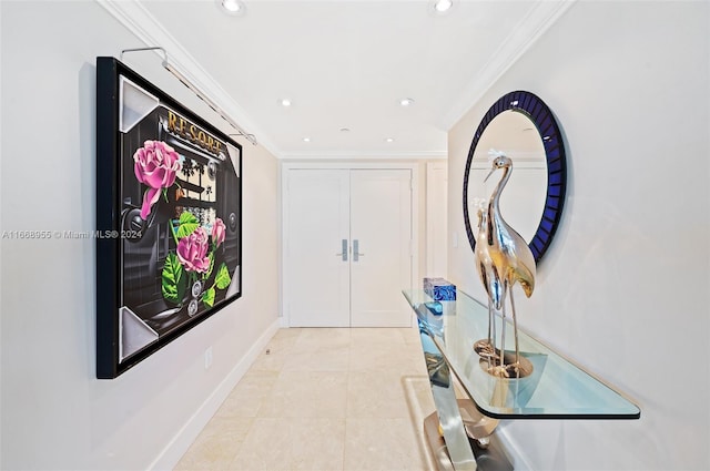 hallway with crown molding, baseboards, and recessed lighting