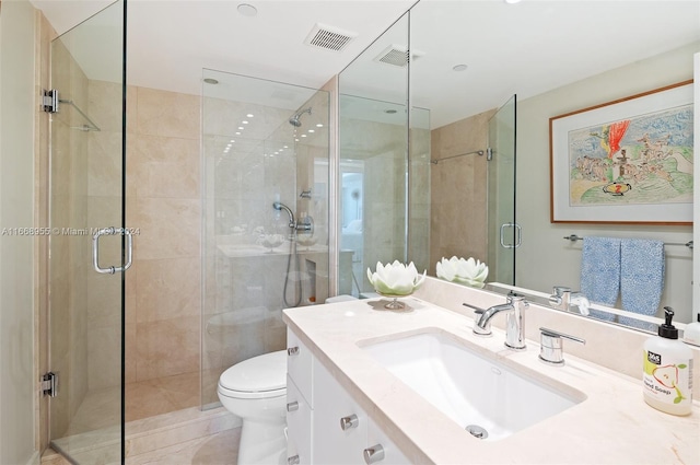 bathroom featuring visible vents, vanity, and a shower stall