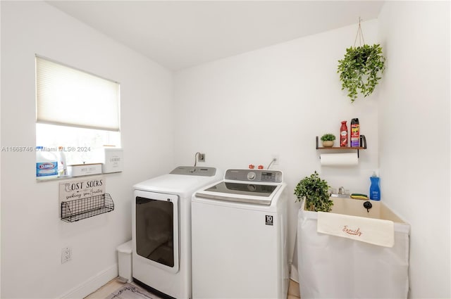 clothes washing area featuring washing machine and dryer