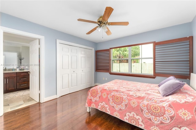 bedroom featuring wood-type flooring, a closet, and ceiling fan