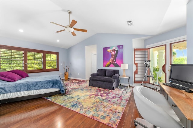 bedroom featuring vaulted ceiling, multiple windows, hardwood / wood-style floors, and ceiling fan