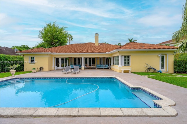 back of property featuring a patio