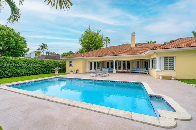 view of pool featuring a patio