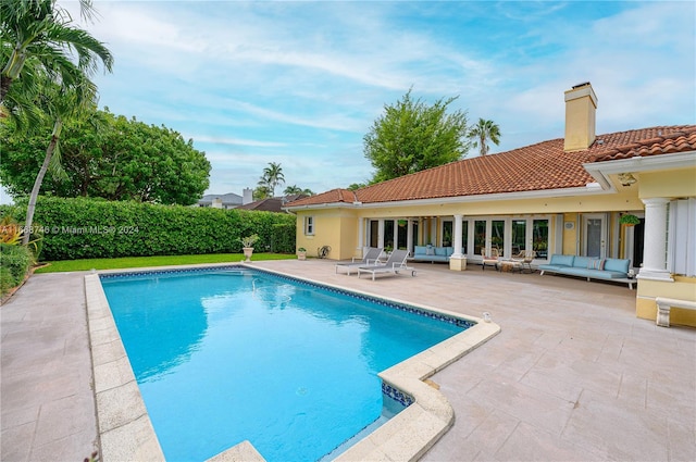 view of swimming pool featuring a patio area