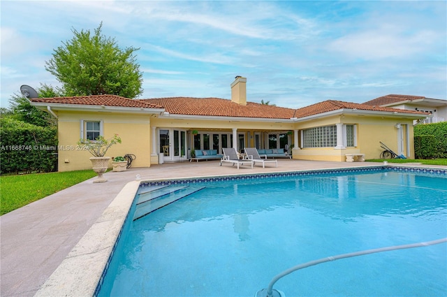 view of swimming pool featuring a patio area