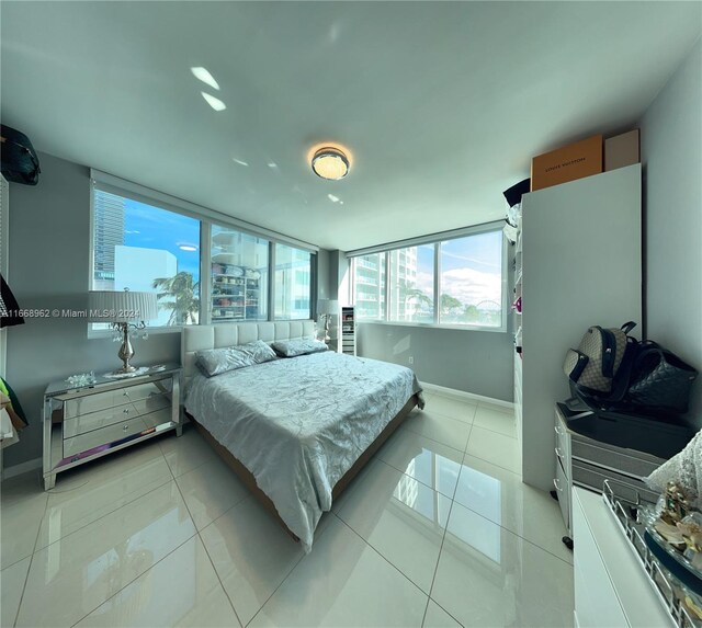 bedroom with light tile patterned floors