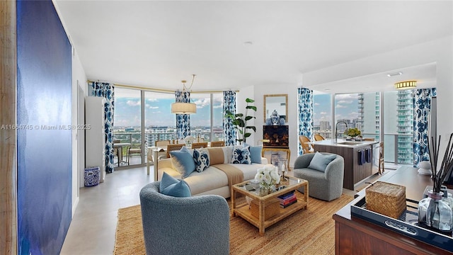 living room with expansive windows and sink