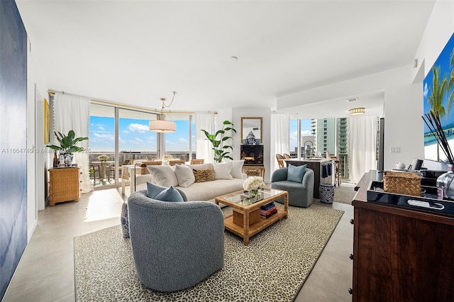 488 NE 18th St Unit 2301, Miami, FL 33132 - living room featuring plenty of natural light, concrete flooring, and a wall of windows