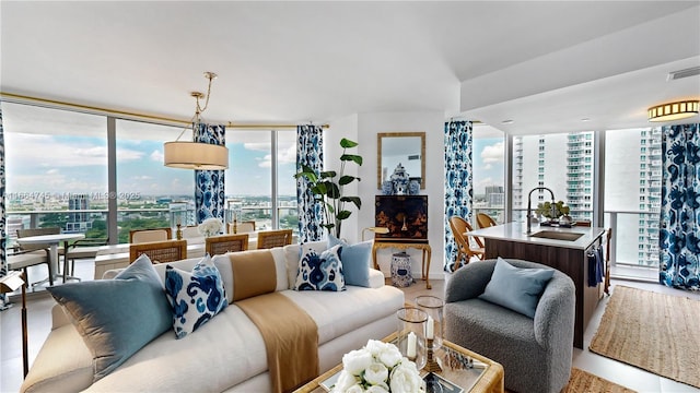 living room with sink and floor to ceiling windows