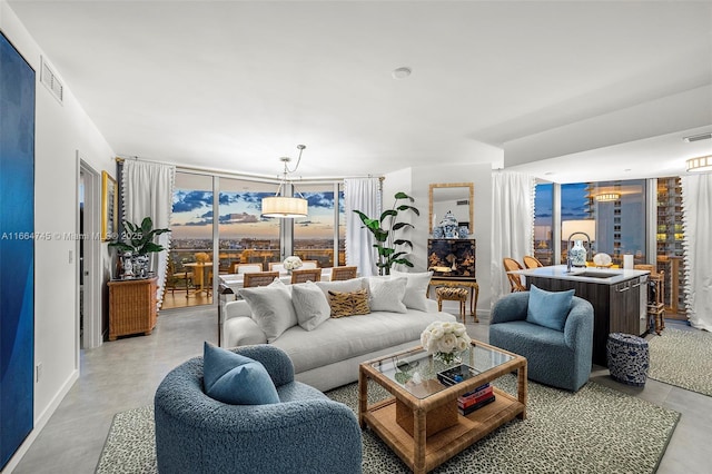488 NE 18th St Unit 2301, Miami, FL 33132 - living room featuring finished concrete flooring and floor to ceiling windows