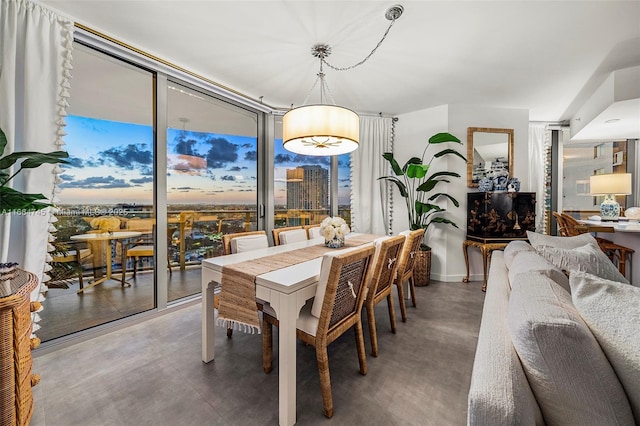 488 NE 18th St Unit 2301, Miami, FL 33132 - dining room with finished concrete flooring and a wall of windows