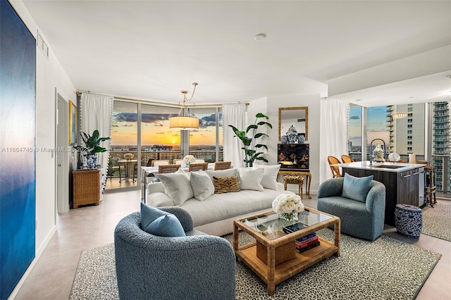 488 NE 18th St Unit 2301, Miami, FL 33132 - living area featuring baseboards and floor to ceiling windows