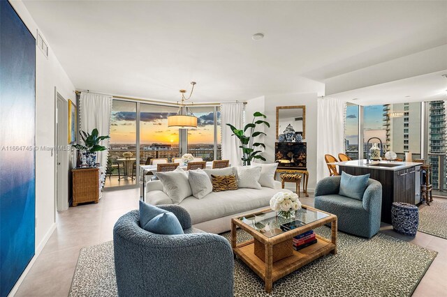 488 NE 18th St Unit 2301, Miami, FL 33132 - living area featuring baseboards and floor to ceiling windows