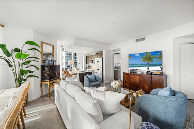 488 NE 18th St Unit 2301, Miami, FL 33132 - living room featuring finished concrete flooring and baseboards
