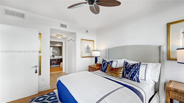 bedroom featuring ceiling fan and ensuite bath