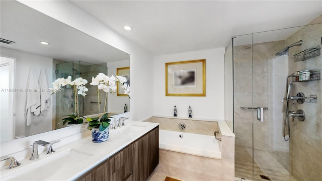 bathroom featuring vanity and shower with separate bathtub