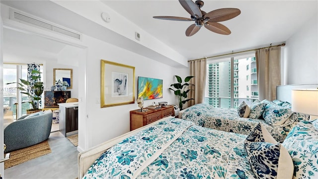 bedroom featuring ceiling fan and light carpet