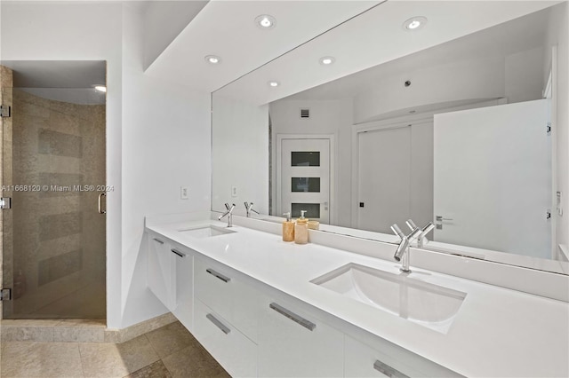 bathroom with vanity, tile patterned floors, and an enclosed shower