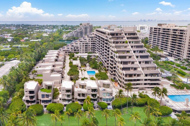 birds eye view of property with a water view and a view of the beach