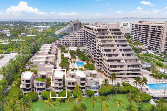 drone / aerial view featuring a view of the beach and a water view