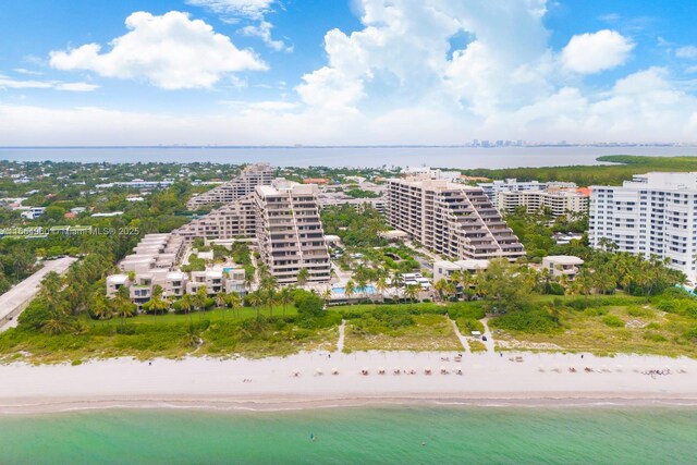 aerial view featuring a view of the beach and a water view