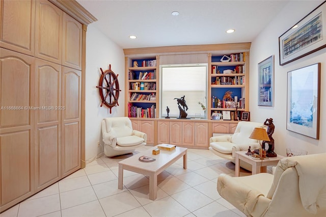 living area with built in features and light tile patterned floors