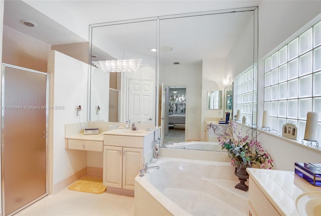 bathroom featuring vanity, tile patterned floors, and independent shower and bath